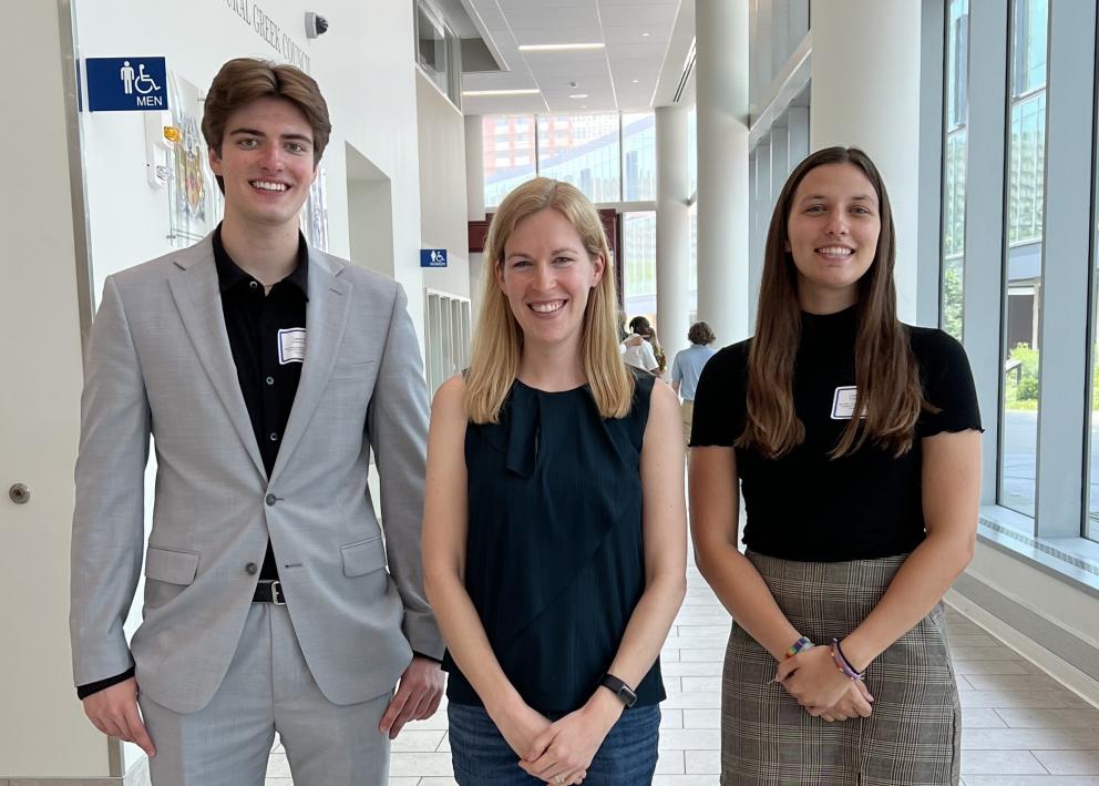 Summer 2024 REU students Carter Stokes and Lauren Hamm with Professor Elizabeth Corson at the REU poster presentation.