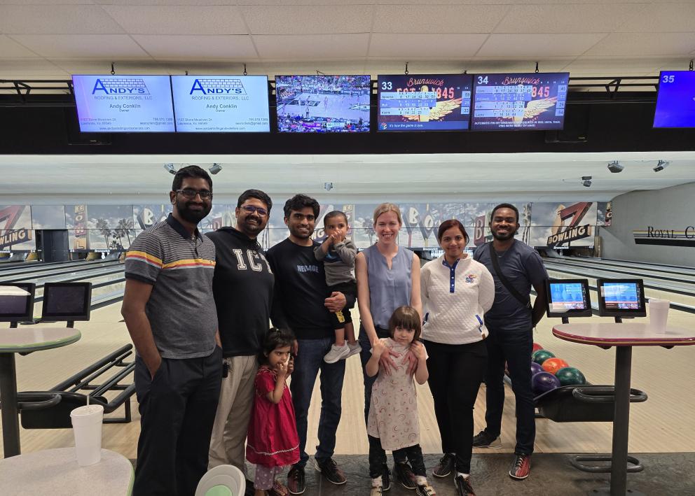 Karthik, Apoorva, Mukhtiar, Professor Corson, Kinithi, and Seth at the bowling alley.